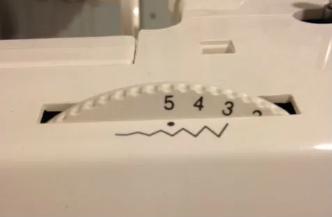 A separate dial for adjusting the zigzag width. A higher number gives a wider seam.