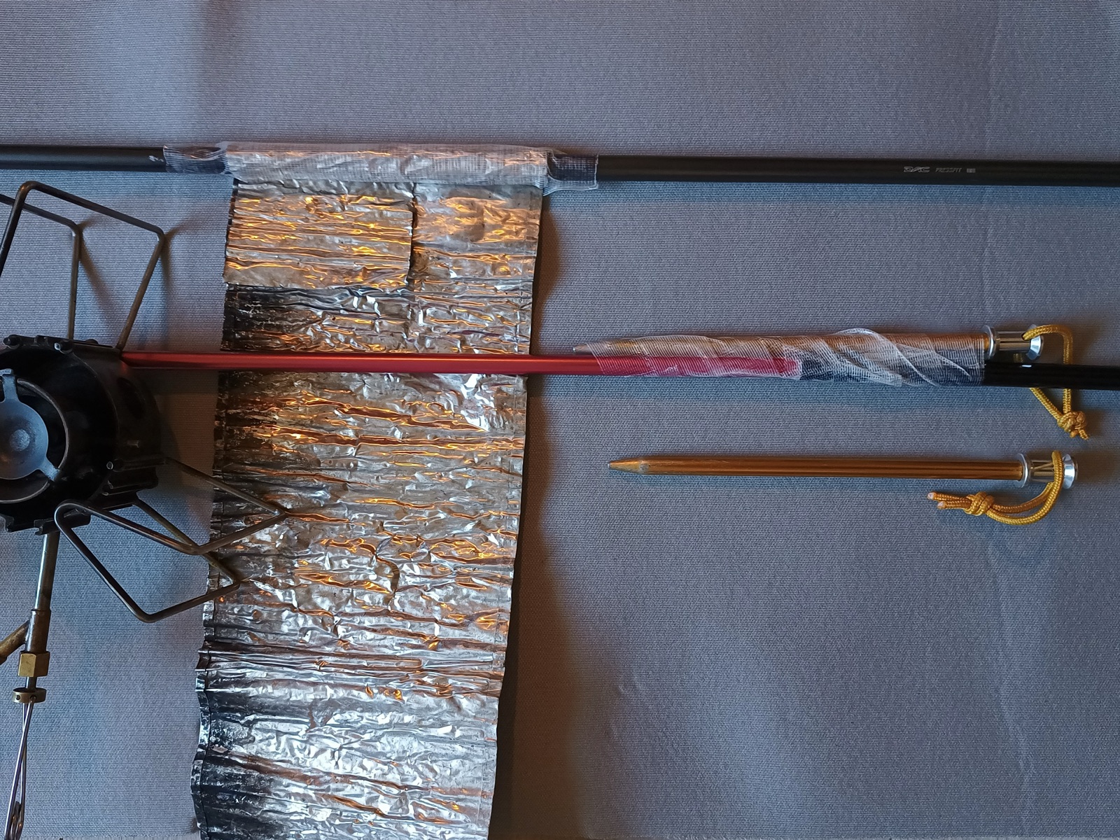 Broken tent pole with repair sleeve.