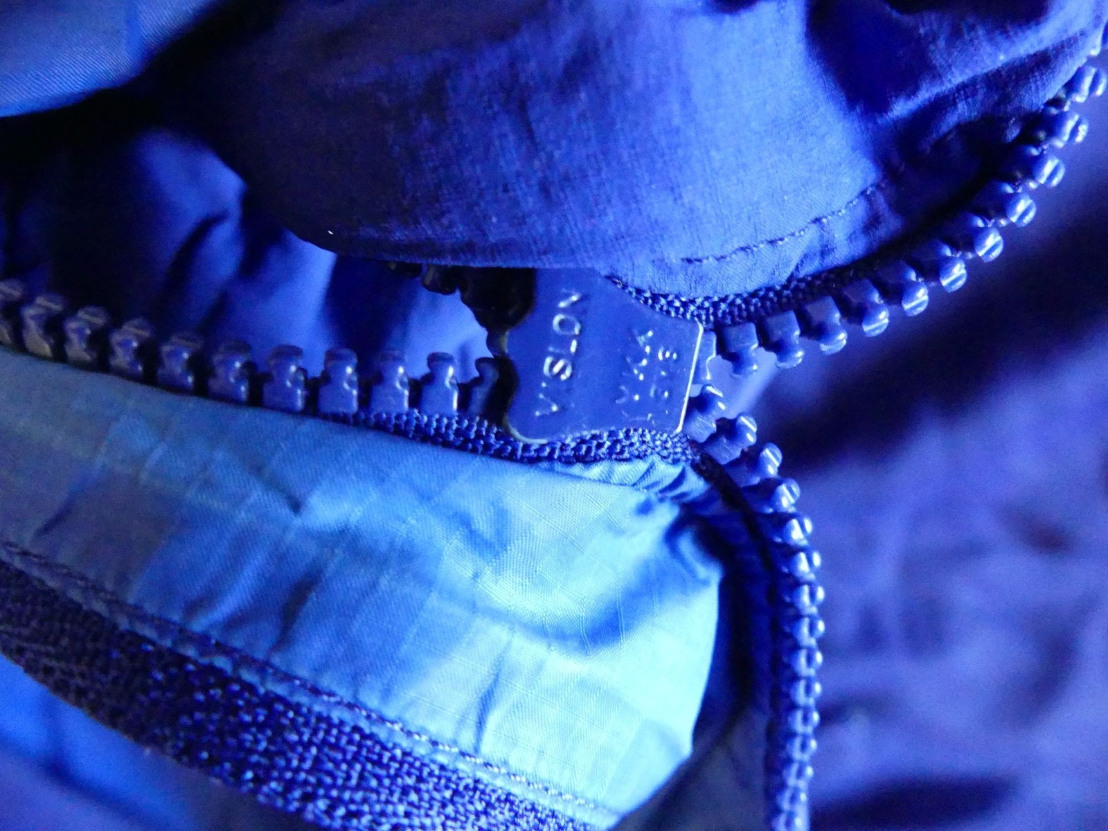 Overview of all repairs — stitching, glue, tape.