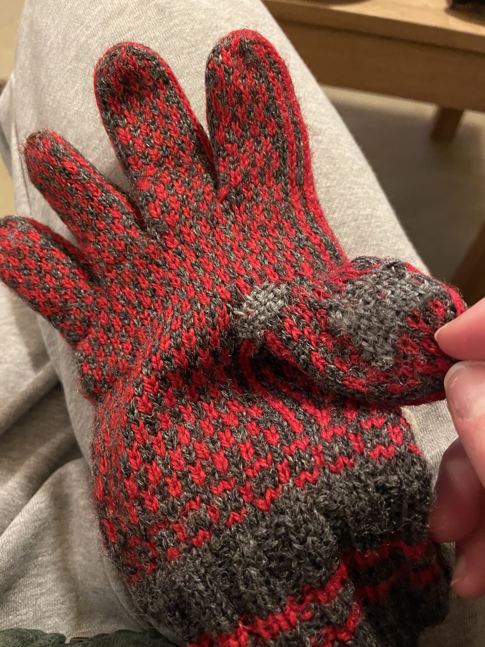 Hole in a wool sock during darning.